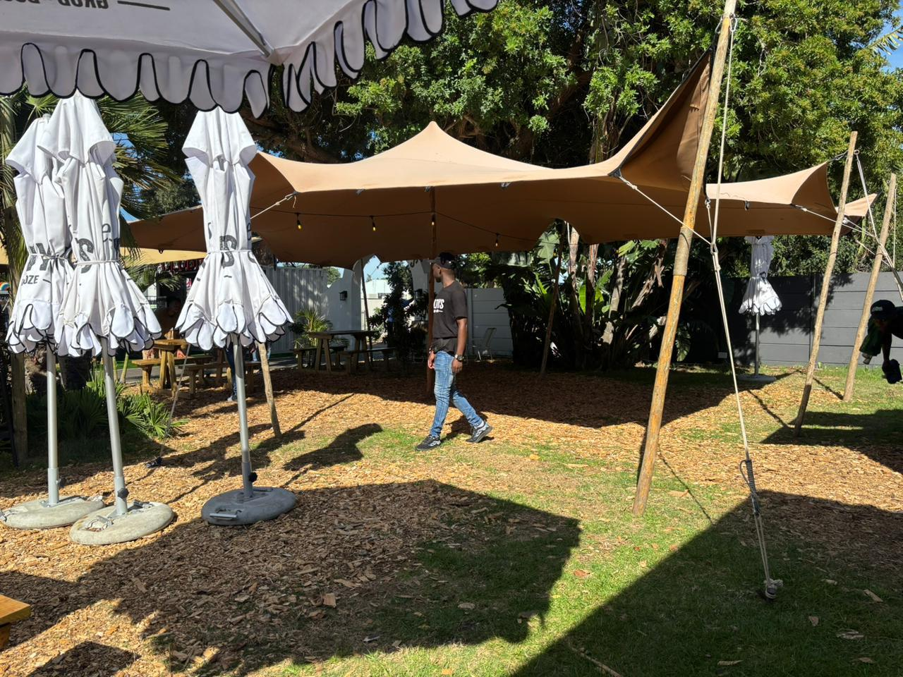 Tan stretch tent with string lights