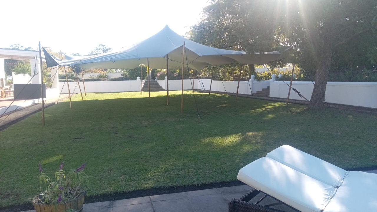 White stretch tent on lawn